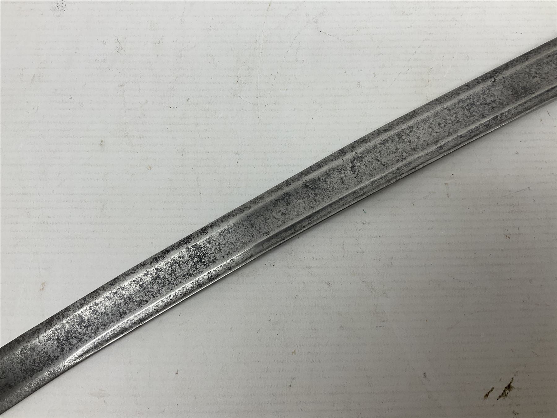 Late 18th century sword, the Spanish 79.5cm curving fullered blade engraved with the Royal Cypher, battle trophies and 'Viva Espania' banner, French Sabre de Mineur brass three-bar hilt with ebonised reeded grip L93.5cm overall (no scabbard)