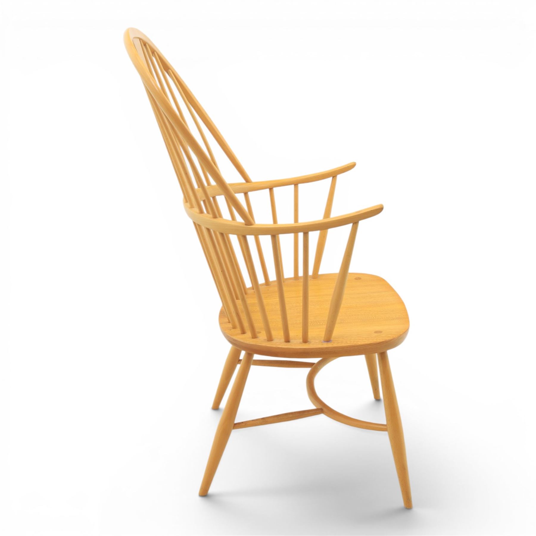 Ercol - Windsor 'Chairmakers' light ash armchair, with traditional spindle backrest, above a dished seat, with cylindrical supports united by a carolean stretcher