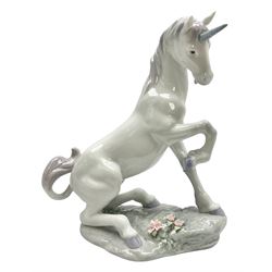 Lladro Privilege figure, Magical Unicorn, modelled as a unicorn with a raised front hoof, sculpted by  Joan Coderch, with original box, no 7697, year issued 2002, year retired 2004, H22cm