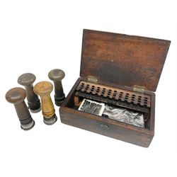 Two Post Office hand stamps 'Heversham Milnthorpe Cumbria' and 'Cimla Neath', together with two hand stamp bodies and various date numbers, housed in a fitted box