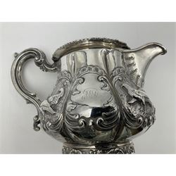 Victorian silver three piece tea service, comprising teapot, twin handled open sucrier, and milk jug, each of bellied form with acanthus capped scroll handles, the sides embossed with alternating scroll edged vacant panels and panels containing a pair of birds, upon four palmette feet, the teapot with ivory insulators to handle, and bird finial to the hinged domed cover, hallmarked William Hunter & Son, London 1861, teapot H19cm, including handles sucrier H13.5cm, including handle milk jug H12cm

This item has been registered for sale under Section 10 of the APHA Ivory Act