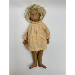Sasha Morgenthaler vinyl doll, the girl's head with painted blue eyes and lips and short blonde hair, the jointed body donning a peach floral dress with matching underclothes, unmarked, H41cm
