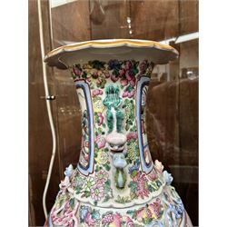Large pair of 19th century Cantonese famille rose vases, each painted with various courtly scenes, including a display of warriors fighting on horseback before an official and his attendants, double Buddhist lion handles and applied at the shoulders with chilong, the lower band painted with Greek key motif, H58cm (2)