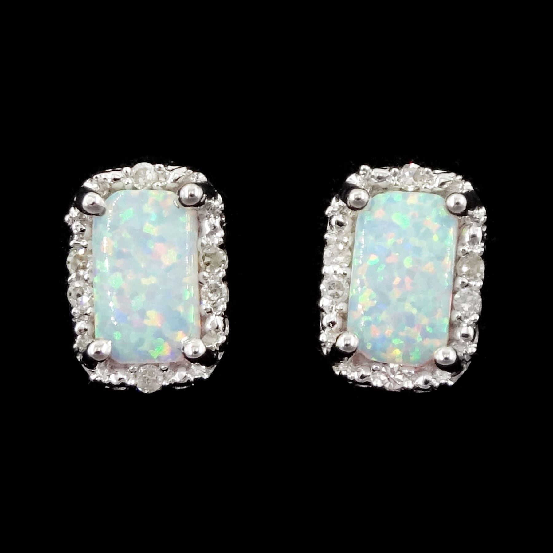 Pair of 9ct white gold opal and diamond stud earrings, stamped 375