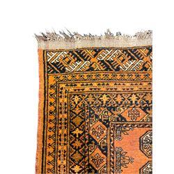 Small Bokhara rust ground rug, the field decorated with Gul motifs, multi-band border