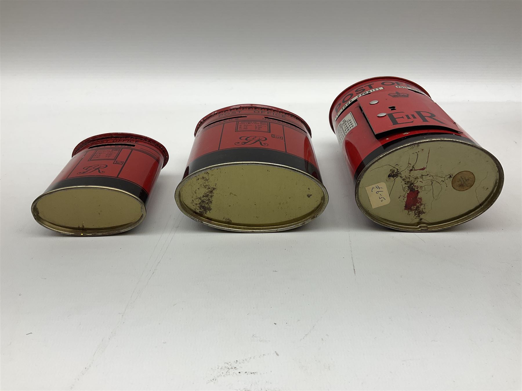 Collection of tin plate money boxes in the form of Royal Mail post boxes, to include four Chad Valley examples, one with key and others similar,  marked VR, GR and ER (10)