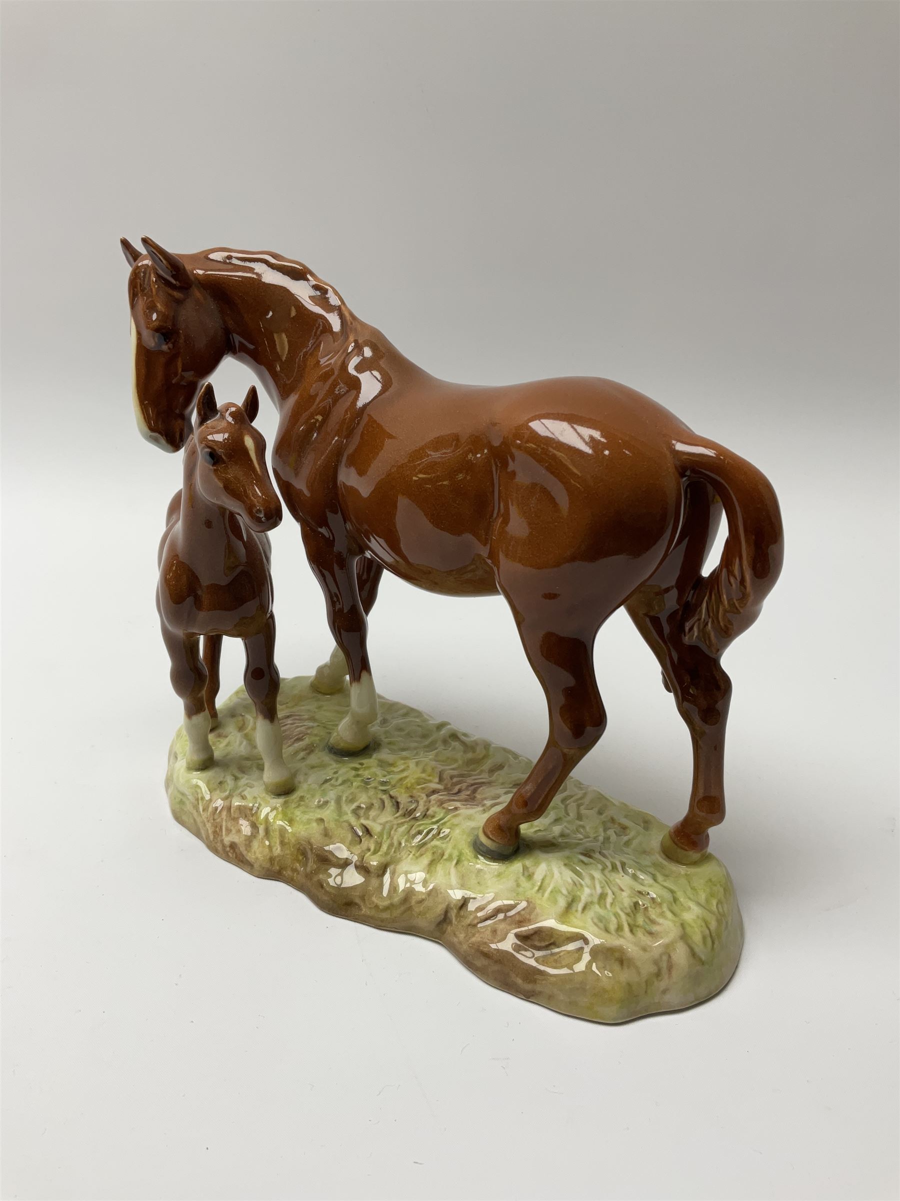 A Beswick model of a chestnut mare and foal on naturalistic base, 2nd version model no 953, with printed mark beneath, H19.5cm. 