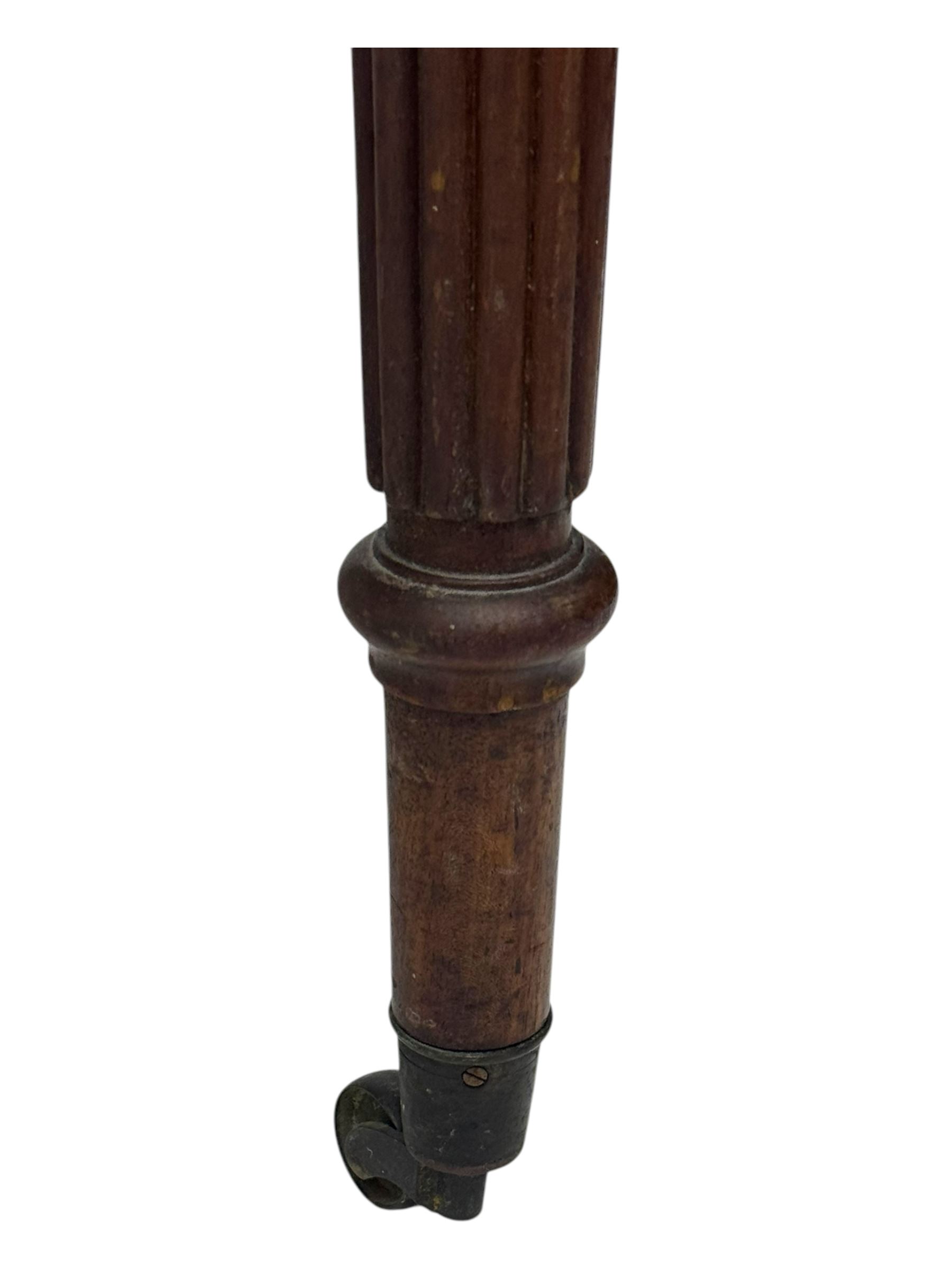 Early 19th century mahogany side table, moulded rectangular top over two drawers, on turned and reeded supports, brass cups and castors 