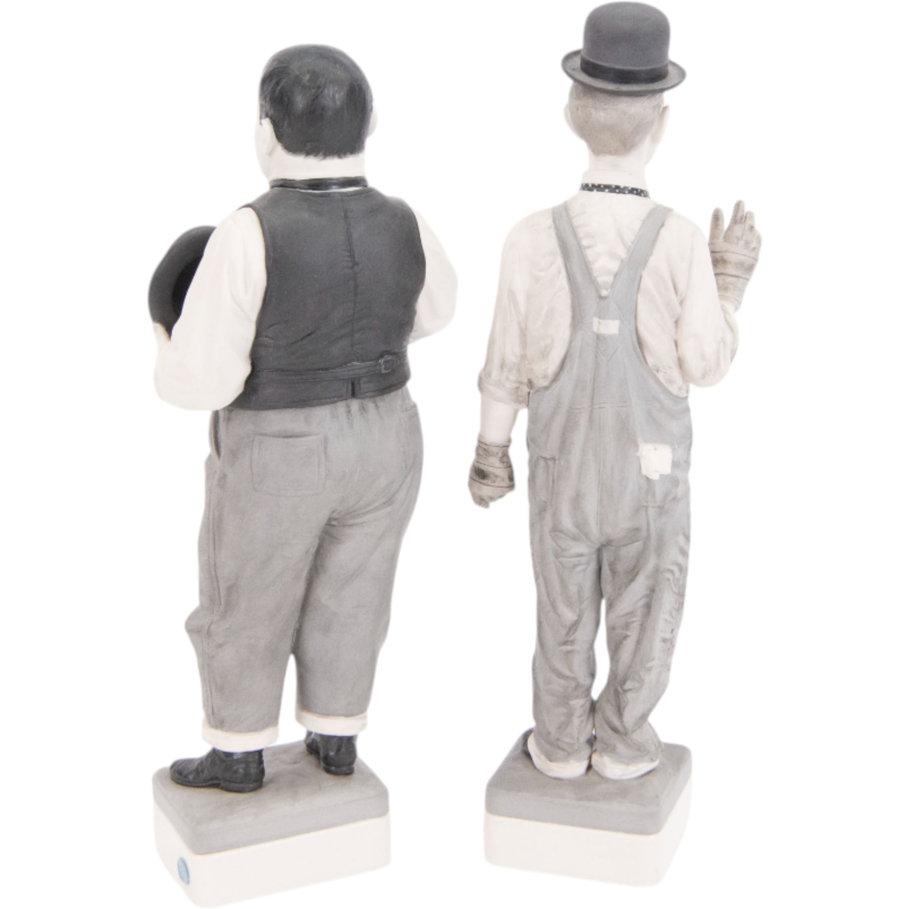 Pair of Spanish Algora Personajes Del Cine figures, modelled as Stan Laurel and Oliver Hardy, with printed marks beneath, both with certificates of authenticity, H37cm