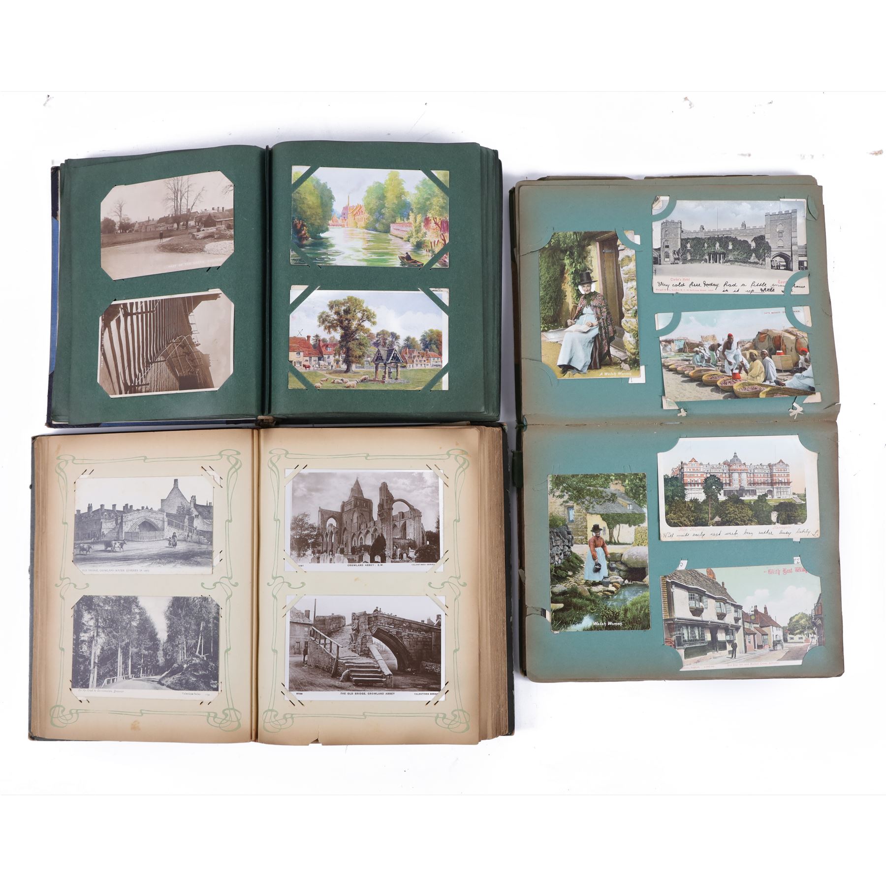 Collection of early 20th century postcards and greetings cards, including WWI embroidered silk Christmas card, black and white family photographs, 1920s birthday cards, black and white and colour postcards of Margate, Ramsgate, Blackpool etc, housed in three postcard albums