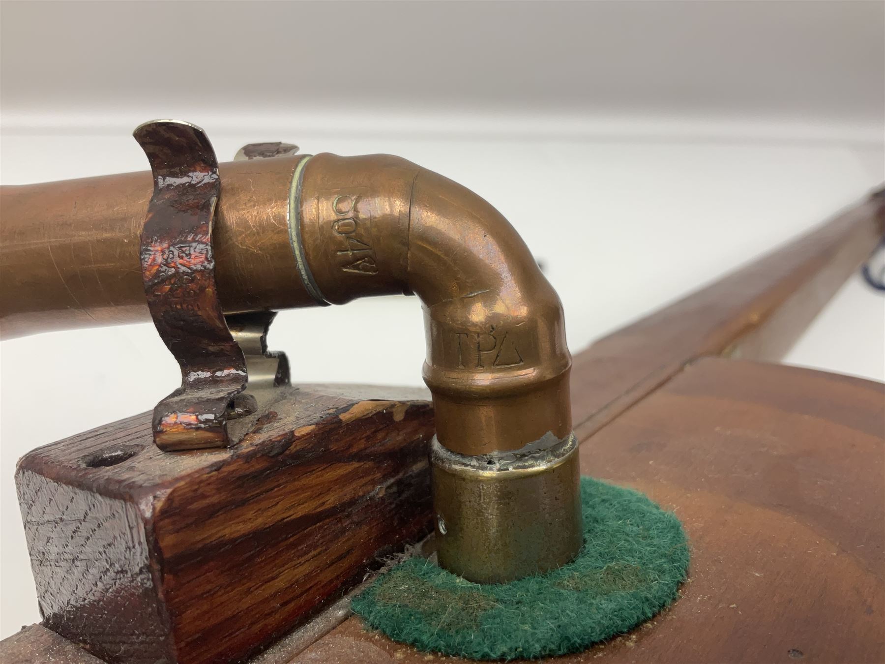 Fruitwood and elm single string phono fiddle with long neck and copper horn L76cm; and a violin bow (2)