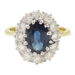 Gold oval cut sapphire and round brilliant cut diamond cluster ring, stamped 18ct, sapphir...