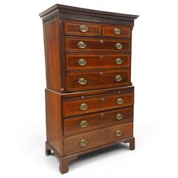  Late 18th century mahogany and inlaid chest on chest, projecting cornice above blind fretwork in laid drawers, the upper chest with two short over three graduating drawers, the lower section with brushing slide over three long graduated drawers, raised on bracket feet