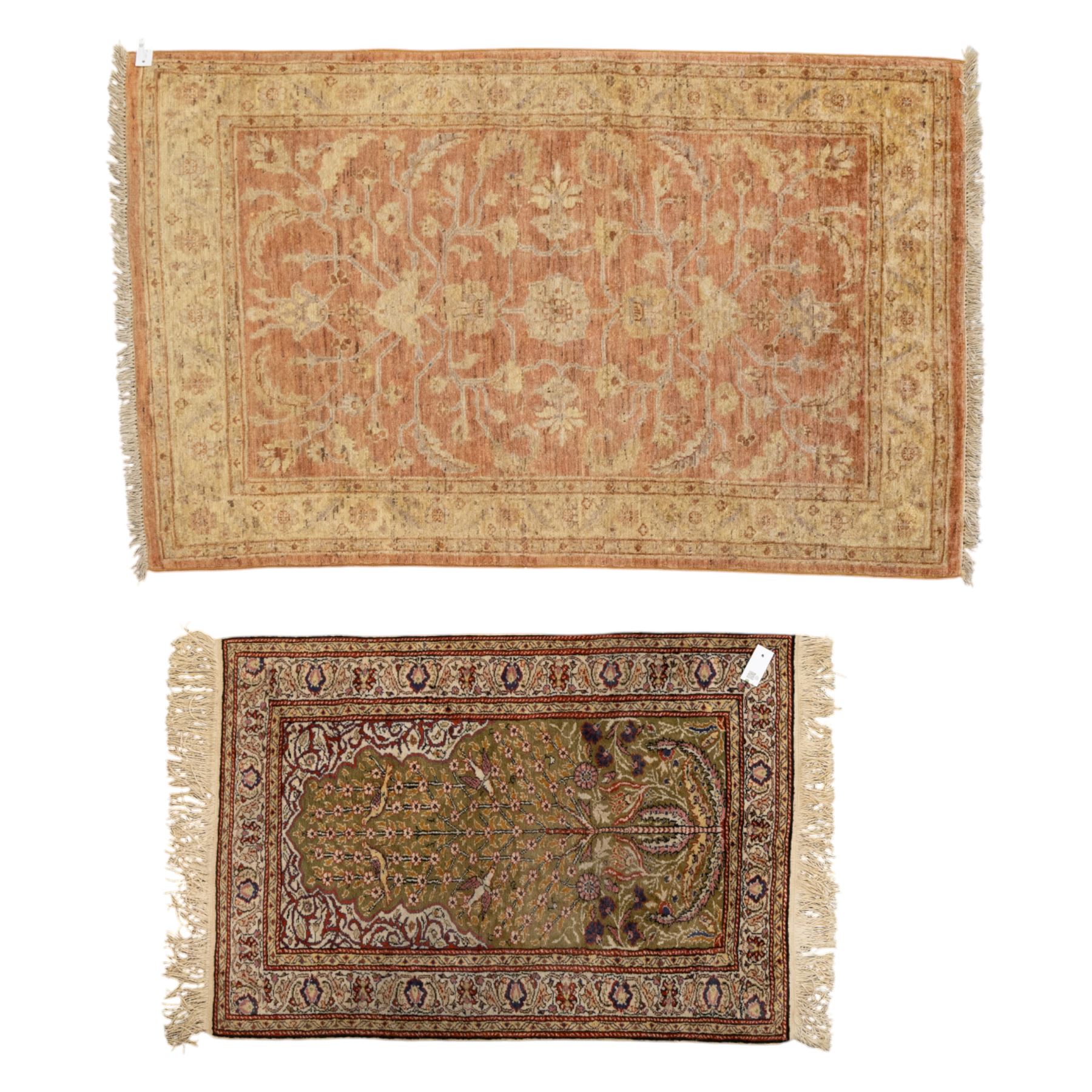 Afghan Ziegler rug, terracotta field with an all-over design of palmettes and stylized foliage in soft beige and gold tones, with a Persian Qum silk prayer rug, with a central tree of life and flowering branches and birds, within multiple floral borders, 88x125cm (2)