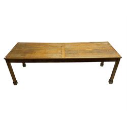 Early 20th century oak dining table, rectangular top raised on square supports 