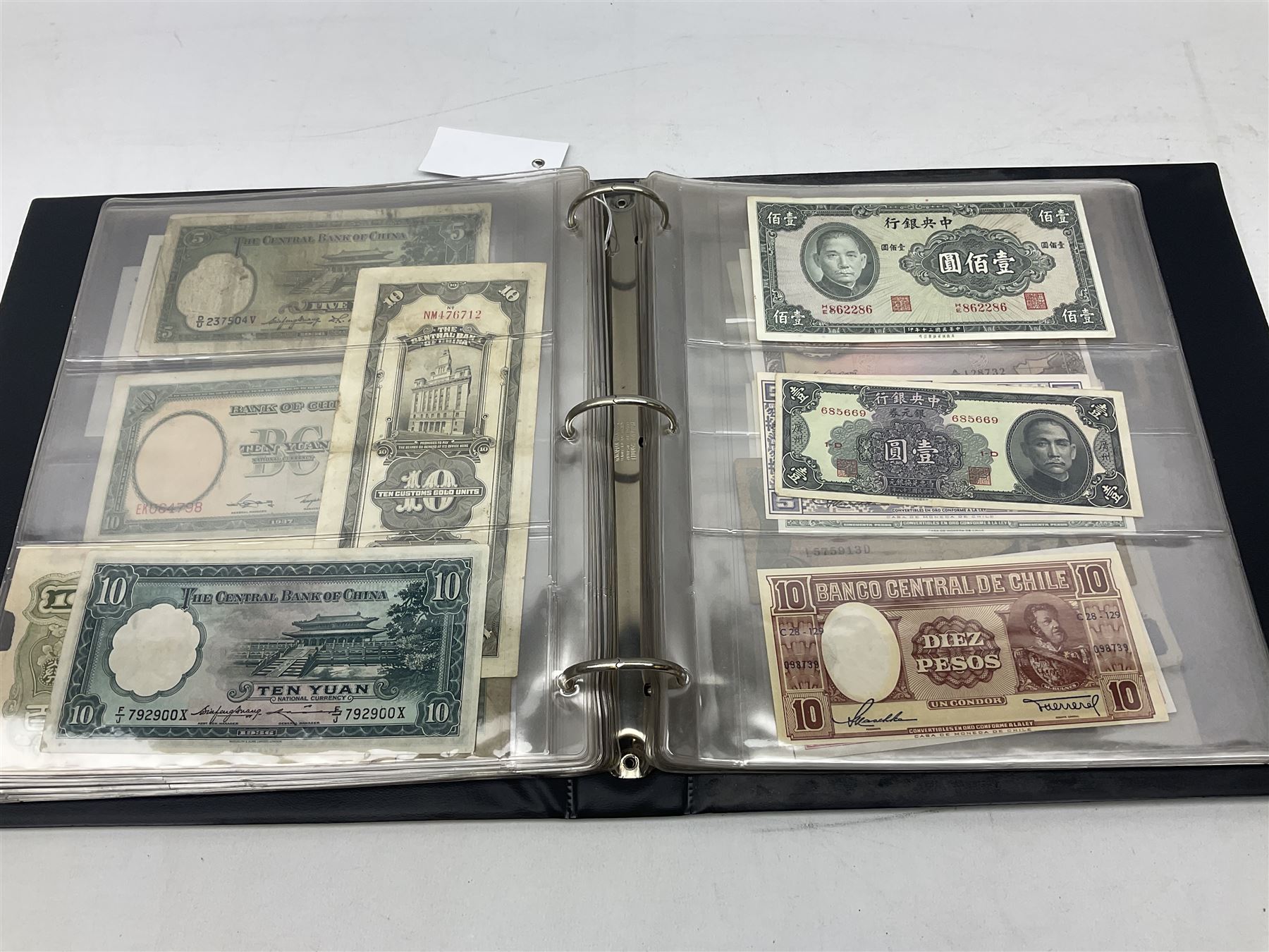 World banknotes, including Queen Elizabeth II The States of Jersey one pound 'DB202703', five pounds 'BB527762' and ten pounds 'AB651481', reserve bank of New Zealand two dollars '1L3 741894', King George V Straits Settlements one dollar 1st January 1935 'F/83 28924', various Bank of England notes etc, housed in two ring binder albums