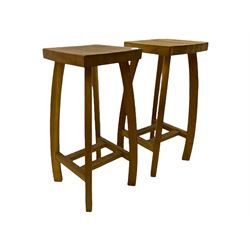 Pair light oak bar stools with dished seats