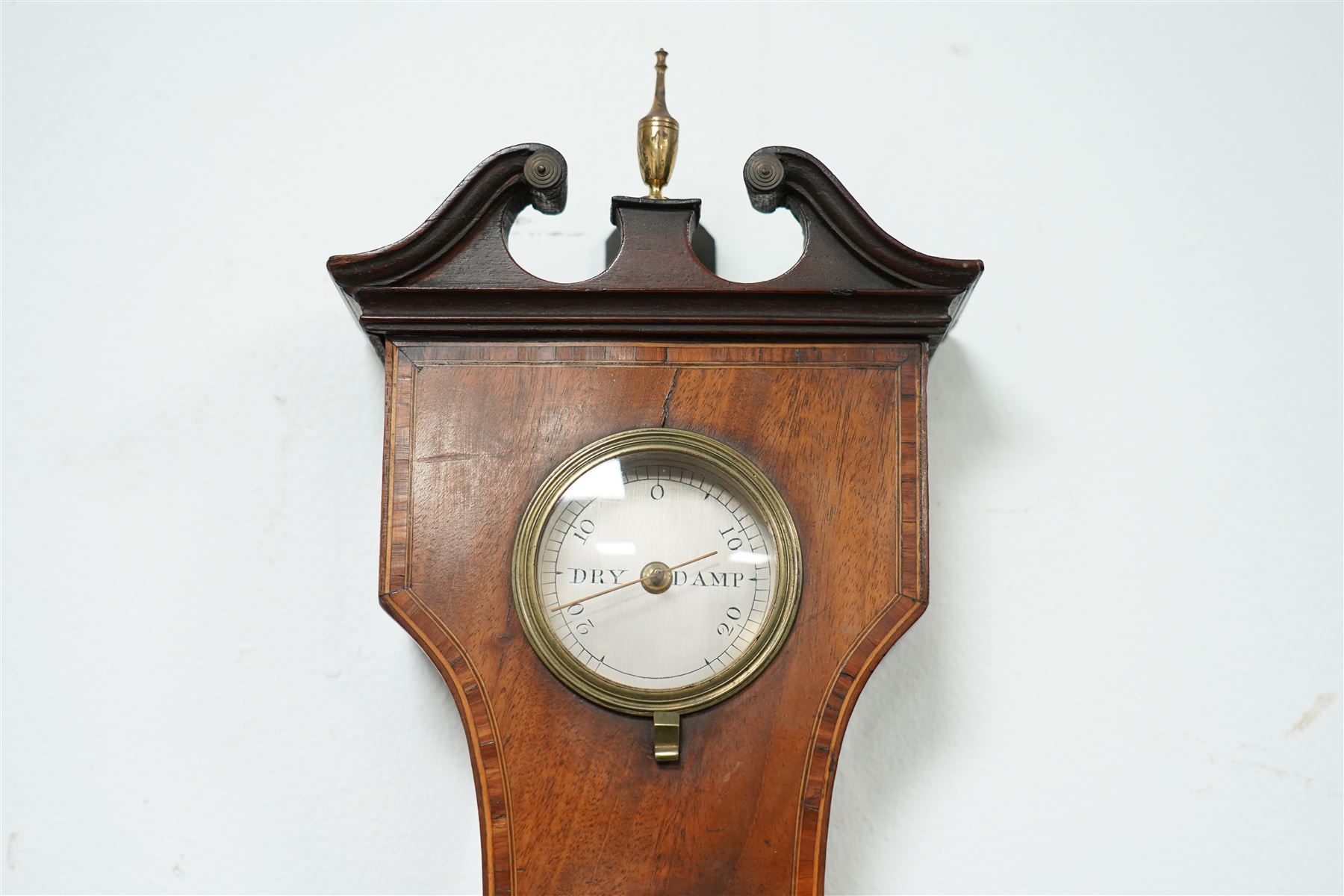Zanetti of Manchester- late 19th century wheel barometer in a mahogany case with a break arch pediment, brass finial and rounded base, with a hydrometer, spirit bubble and boxed spirit thermometer, 12