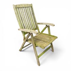 Five piece teak garden dining set, comprising circular folding table and four folding armchairs, with slatted seats and backs in a weathered finish