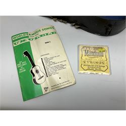 Dulcet eight-string banjo mandolin with mother-of-pearl inlaid ebonised fingerboard L55.5cm; cased; and Irish mahogany bodhran hand drum with inlaid stringing and vellum top D46.5cm; in soft carrying case with double ended beater (2)