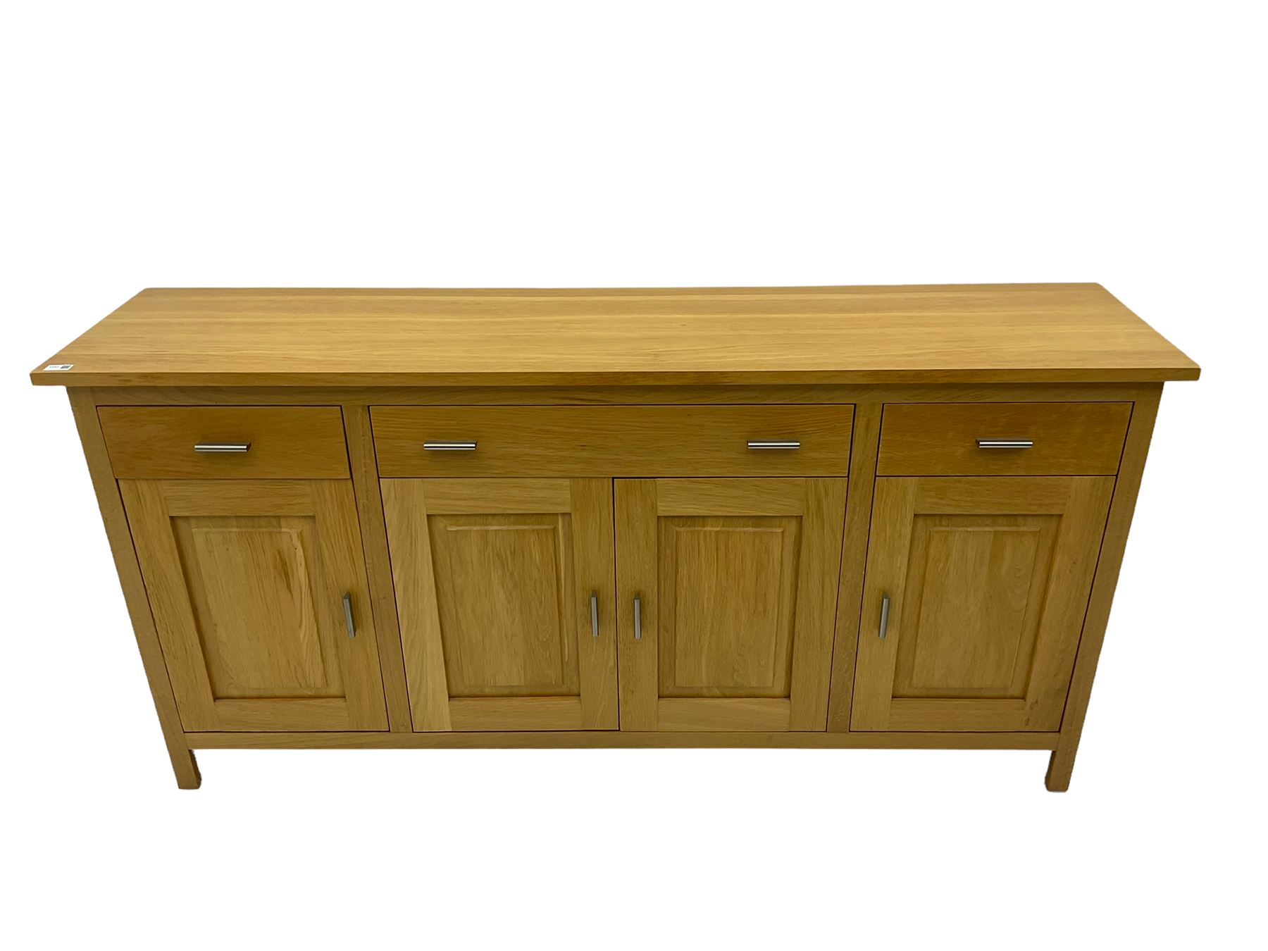 GPlan light oak sideboard, fitted with three drawers and four