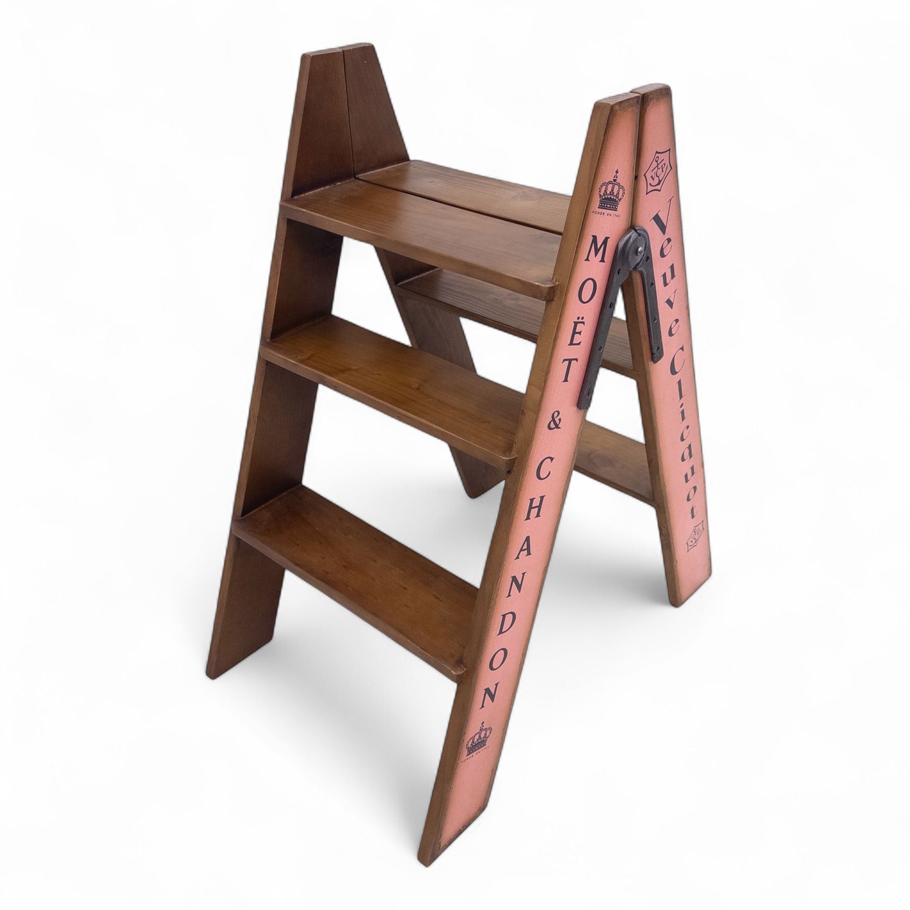 Three-piece champagne advertising display set, comprising pine steps with painted Dom Pérignon and Bollinger lettering, and two wooden boxes branded Moët & Chandon and Veuve Clicquot (Steps H 80cm, W 44cm, D 68cm, crates each H 18cm, W 44cm, D 26cm)
