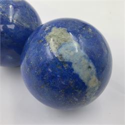 Pair of Lapis lazuli spheres, upon a carved stone stands, D8cm