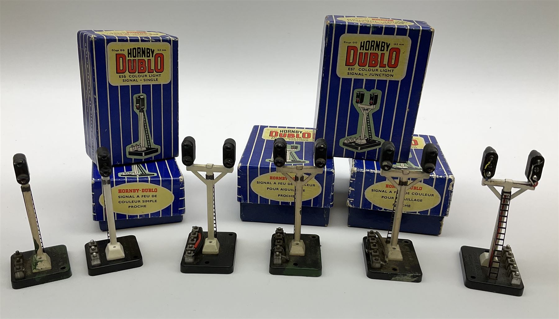 Hornby Dublo - fifteen electric semaphore signals comprising three ED1 Single Arm; two ED2 Double Arm; one ED3 Junction Signal Upper Quadrant; two ES6 Colour Light Signal - Single (Home); and three Colour Light Signal - Junction (Home); all boxed; together with four unboxed electric signals (15)