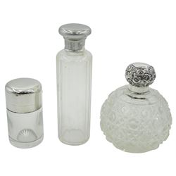 Group of silver mounted cut glass dressing table jars and bottles, of various size and form, to include example of plain cylindrical form with star cut base and hinged cover, opening to reveal stopper, hallmarked John Grinsell & Sons, Birmingham 1890, other examples with various hallmarks, dates ranging 1905 to 2000, approximate total weighable silver 3.31 ozt (103 grams)