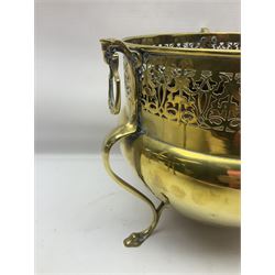 Early 20th century brass coal bucket with pierced sides, upon three pad feet, together with a pair of brass fire dogs, with flambe finials, coal bucket H27cm