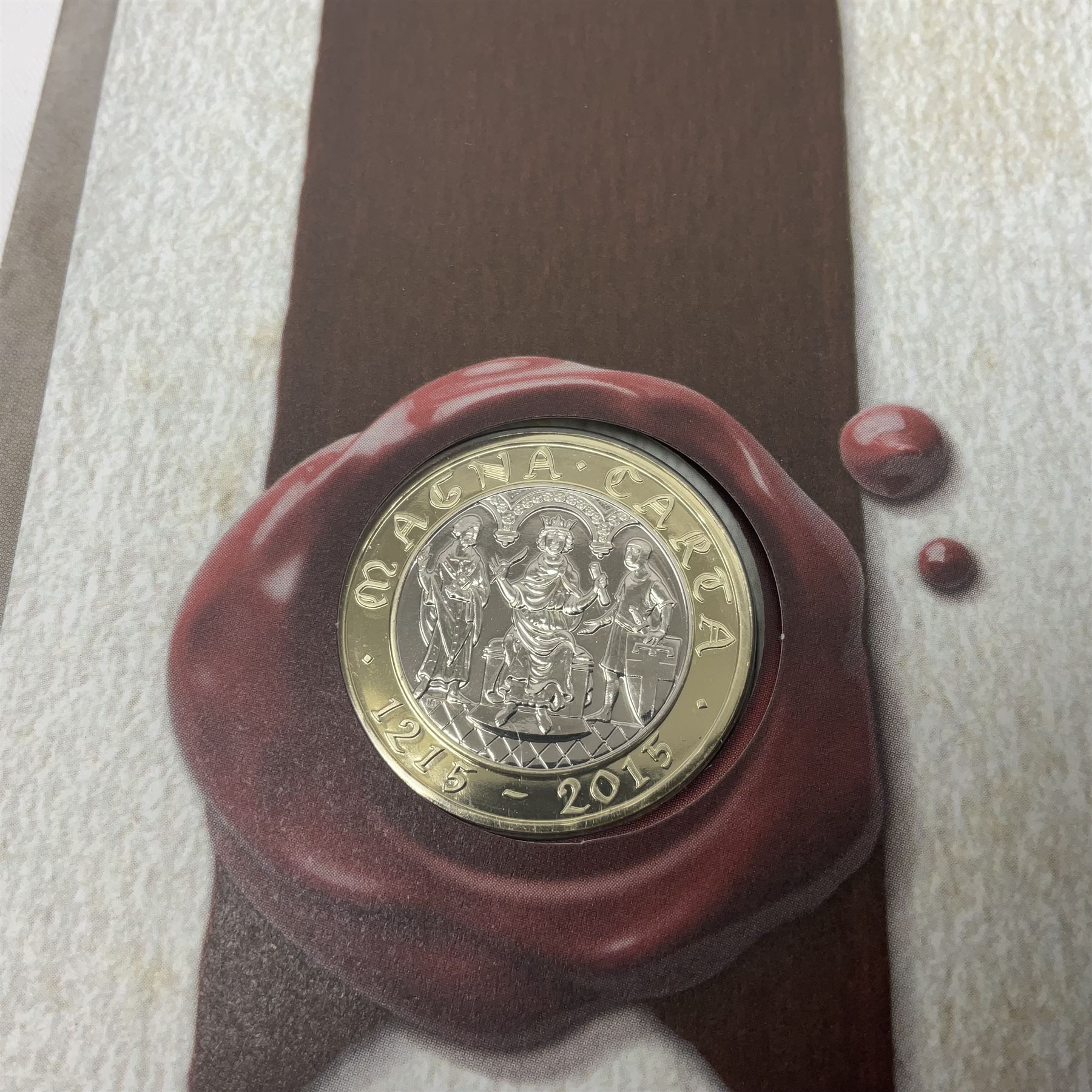 Mostly commemorative coinage, including various Queen Elizabeth II United Kingdom brilliant uncirculated fifty pence, two pound and five pound coins in card folders, The Royal Mint United Kingdom 2012 proof coin set, Alderney 2021 'Royal National Lifeboat Institution' five pound coin cover in Harrington and Byrne folder etc