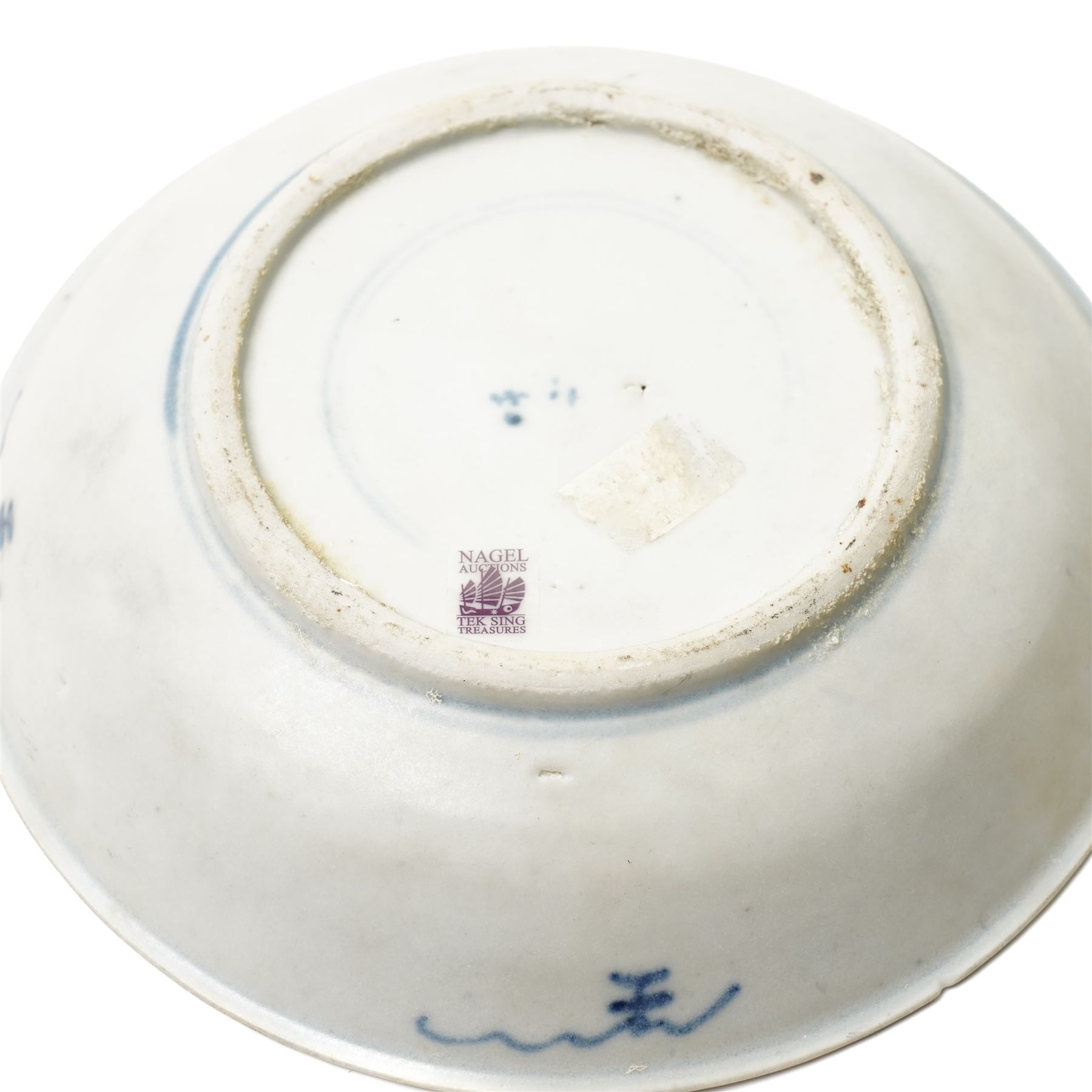 Early 19th century Chinese Tek Sing cargo saucer dish with Nagel Auctions label D18.5cm Chinese, Kangxi blue and white square section vase H24cm and a turquoise glazed Dog of Fo L26cm (3)