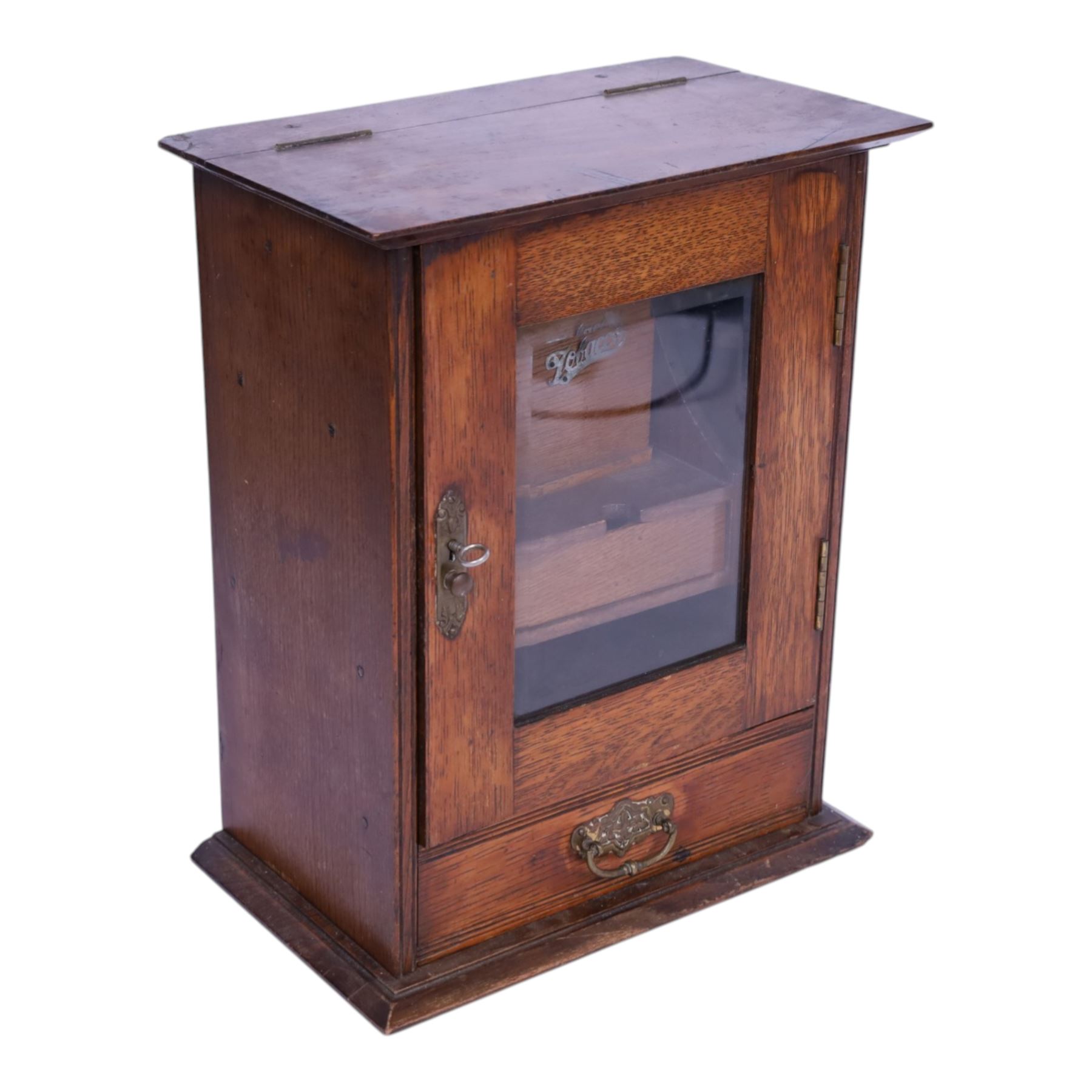 Oak smoking cabinet, with hinged lid, the glazed door opening to reveal a fitted interior, over a single drawer, together with a wooden tobacco box with lid, cabinet H39cm