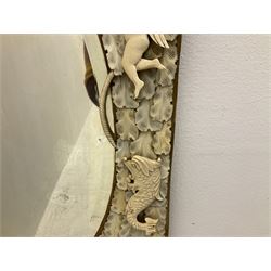 Pair 19th century French Dieppe bone and ivory wall mirrors, the oval bevelled mirror plates within rectangular frames with shaped tops, profusely decorated with ivory leaves, further detailed with carved bone armorial type crest inscribed 'SGOTORVM', putti, fish and mask heads, H81cm W48cm