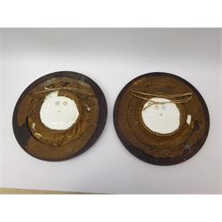 Pair mid 19th century Sevres porcelain plates, with gilt Louis Phillippe crowned monogram to centre upon a white glazed ground, with blue crowned LP mark, iron red destination mark for Chateau D'Eu, and chrome green cancelled potting mark S67 beneath, in carved oak mounts, overall D34cm
     