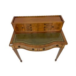 Georgian design yew wood serpentine writing desk, fitted with raised correspondence drawers and two pigeonholes, inset leather writing surface over two drawers, raised on square tapering supports with spade feet