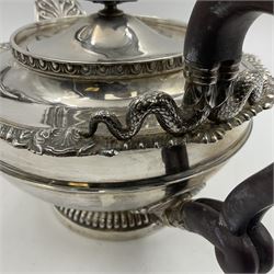 Mid 20th century silver five piece tea service, comprising teapot of squat circular form with cast gadroon, palmette and serpent detail, and ebonised scroll handle and finial, upon a reeded circular foot, slop bowl, sucrier, milk jug, and stand, each of conforming design, hallmarked James Dixon & Sons Ltd, Sheffield 1932, 1934 and 1936, teapot H16cm