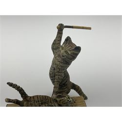 After Bergmann, two cold painted bronze figures, the first modelled as two cats on a bench hugging, the second a cat caning a kitten