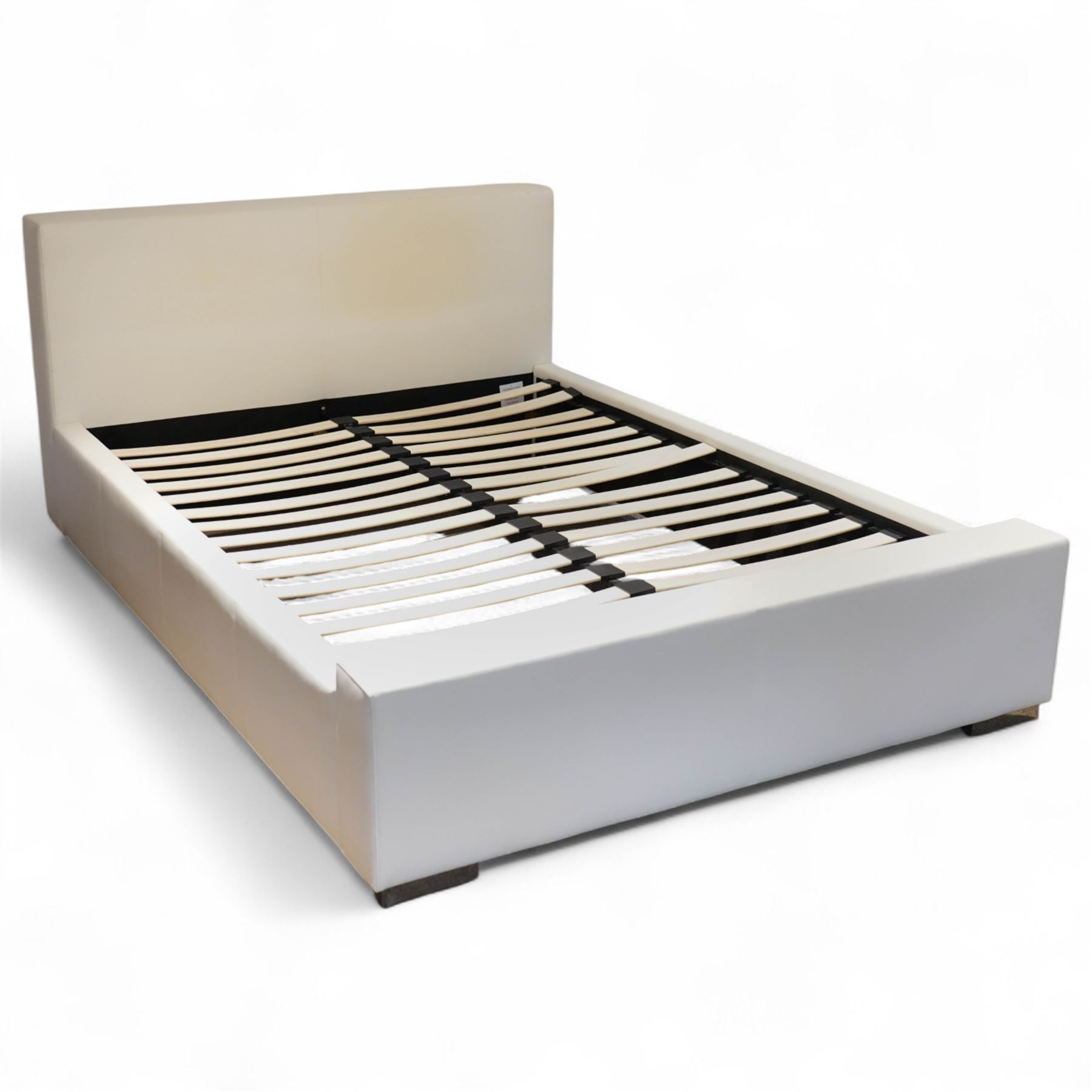 Contemporary upholstered double size bed frame, plain rectangular headboard and footboard upholstered in cream faux leather, sprung beech slatted base raised on concealed feet