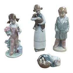 Four Lladro figures, including Girl holding bird no 5217, Duck and Ducklings no 4895 etc, together with Nao and similar figures 