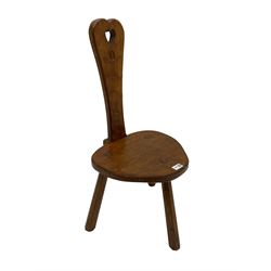 Acornman - adzed oak spinning chair, spoon shaped back with pierced heart and acorn signature, spade-shaped seat raised on octagonal tapering supports by Alan Grainger of Brandsby