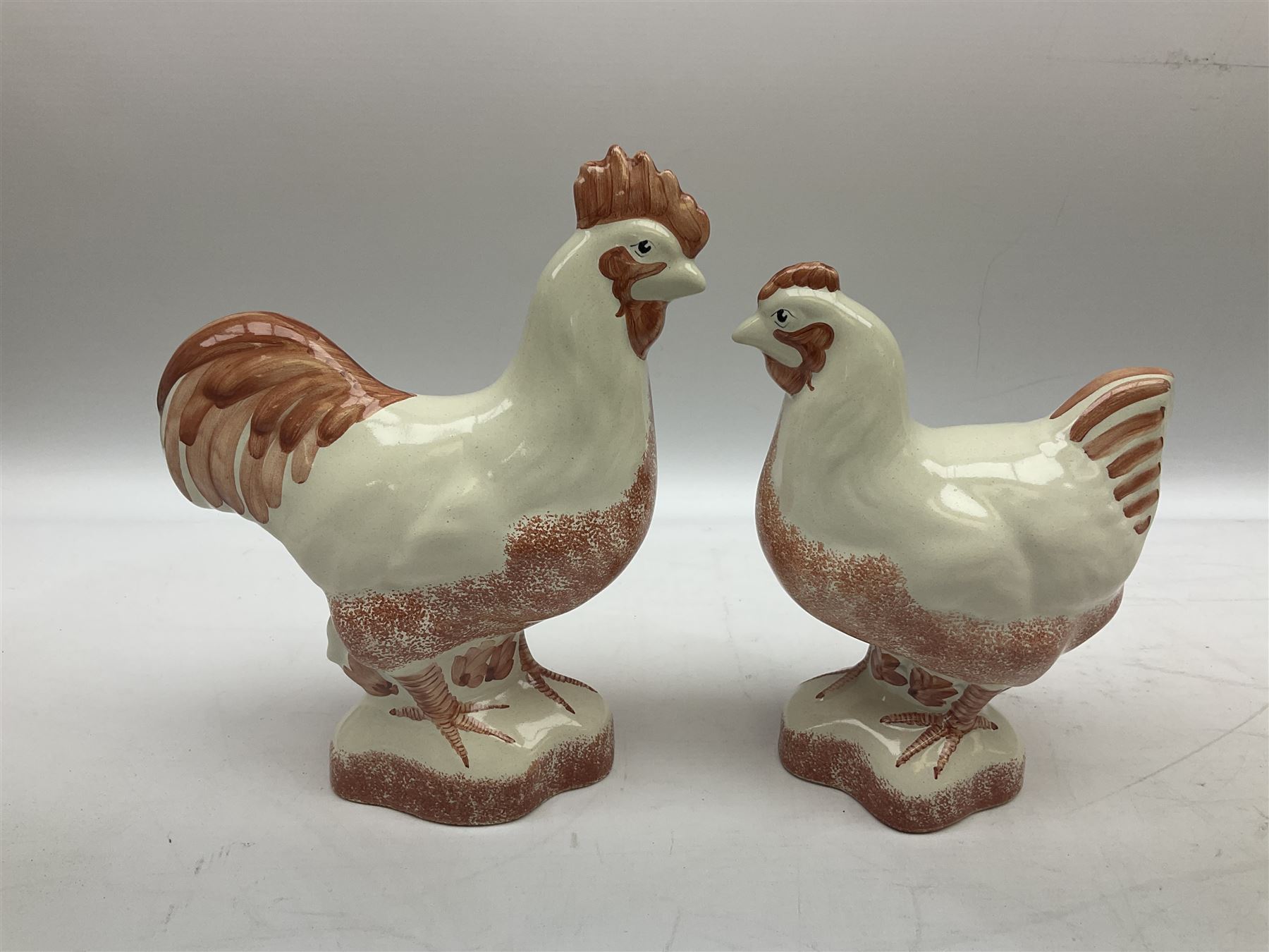 Six Rye Pottery figures, comprising, jumping fox, squirrel upon a branch, billy goat, bull, chicken and cockerel  