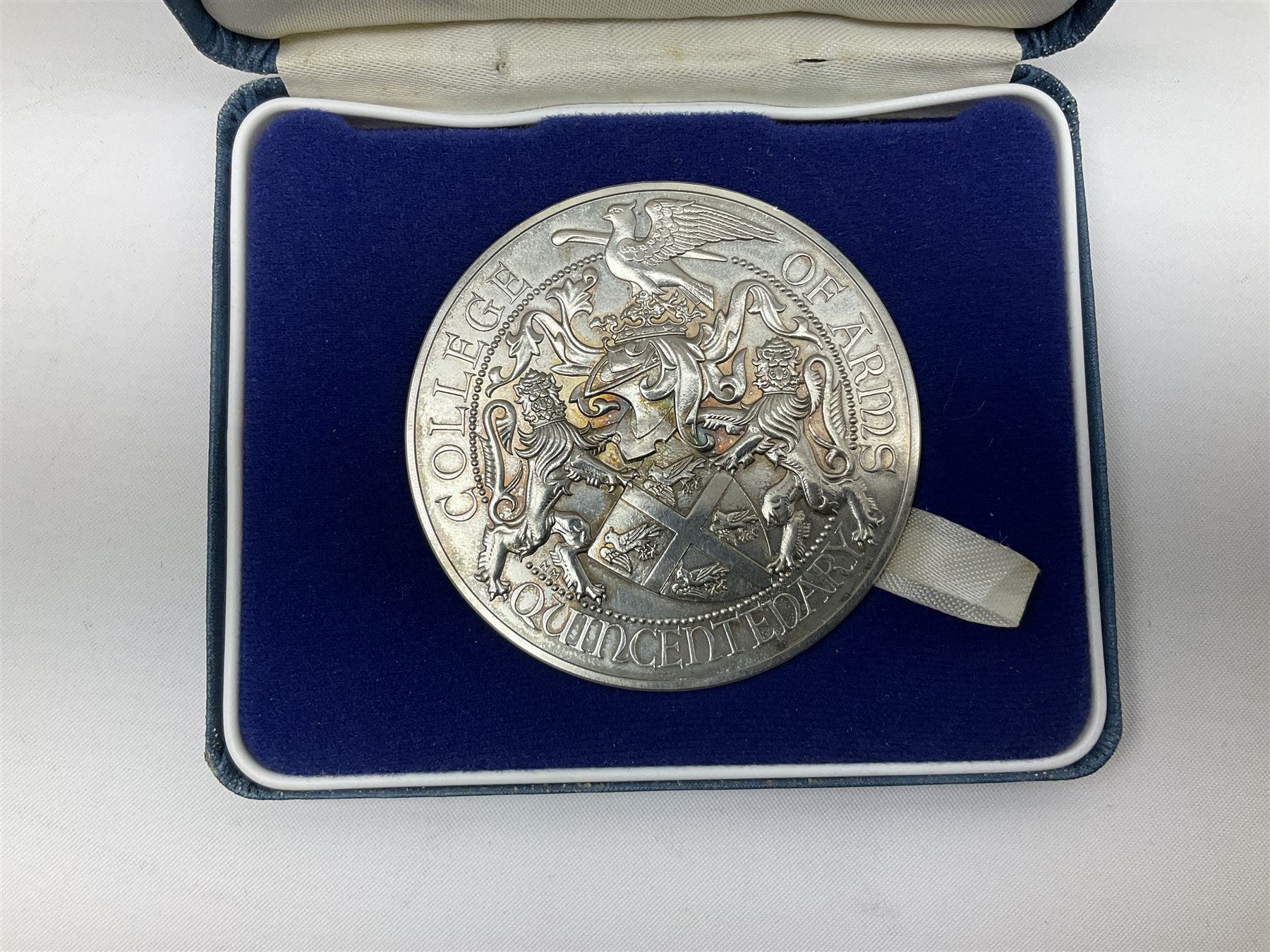 Hallmarked sterling silver commemorative medallion, 'College of Arms Quincentenary', approximately 150 grams, housed in a Royal Mint box