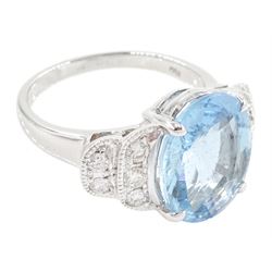 18ct white oval cut aquamarine ring, with milgrain set diamond, stepped design shoulders, stamped 750, aquamarine approx 4.55 carat, total diamond weight 0.35 carat