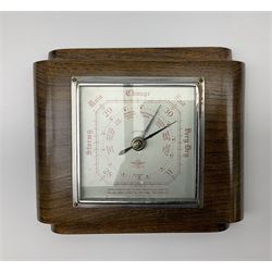 Two pairs of Balinese carved wooden bust figures of a man and woman, with elaborate head dresses, along with other wooden carved figures, a small barometer and a framed print. 