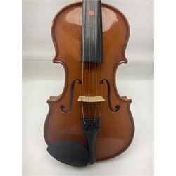 Four Chinese graduated violins - full size with 35.5cm two-piece back; three-quarter size with 33.5cm two-piece back; half size with 31cm two-piece back; and quarter size with 27.5cm two-piece back; all cased except full size; one with bow (4)