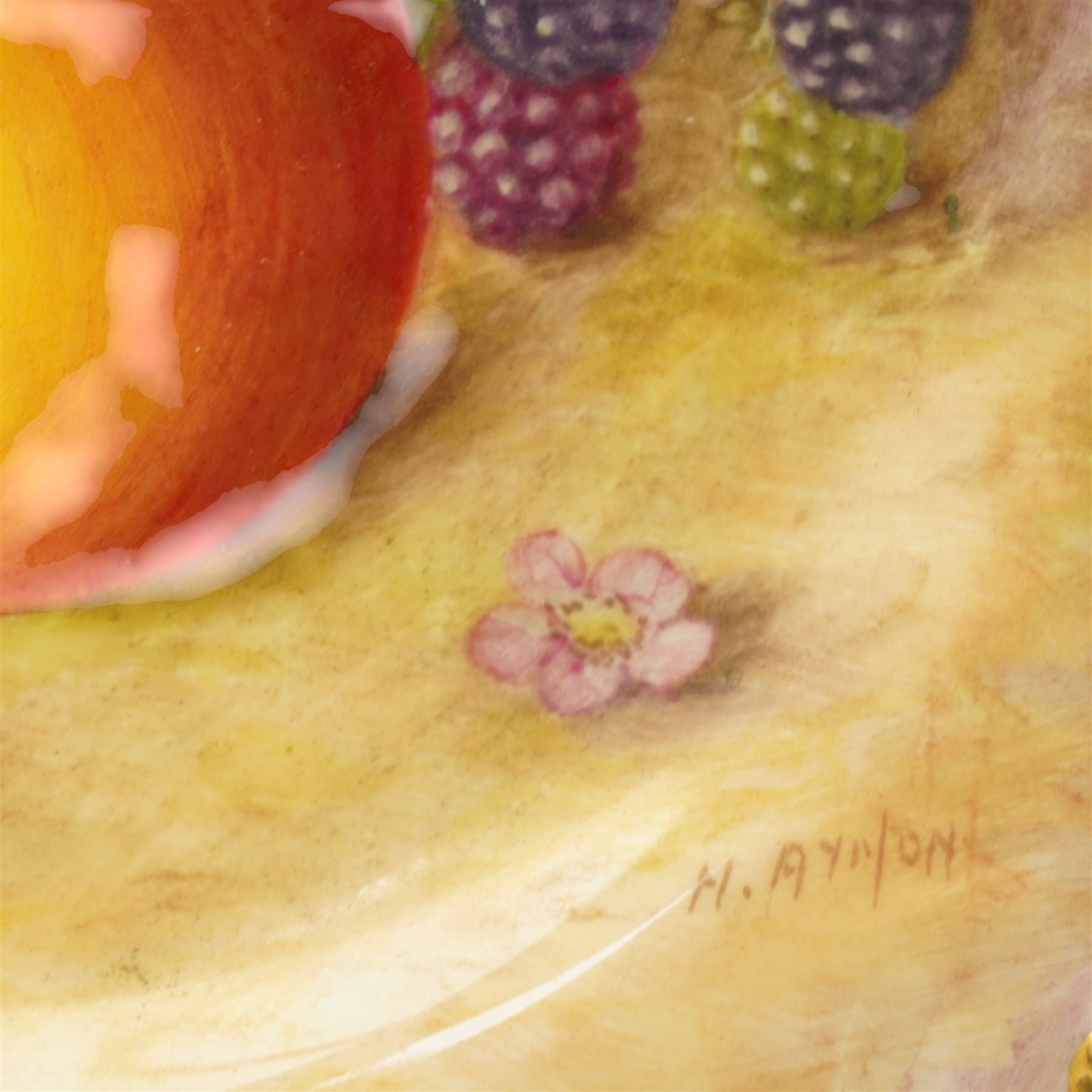 Royal Worcester porcelain cabinet plate by Harry Ayrton painted with fruit on a mossy bank within a shaped, gilded, gadrooned border, signed,  black printed mark and date code for 1949 D23cm