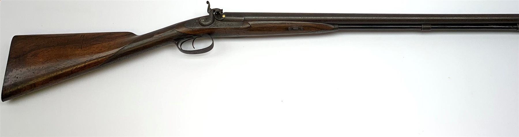 19th century 13-bore muzzle loading, percussion cap, side-by-side double barrel sporting gun by W. Needler Hull, the walnut stock with chequered grip and steel butt plate, engraved action, pineapple finials to fore-end, gold escutcheon, 74cm barrels with under barrel ramrod,  L116cm overall