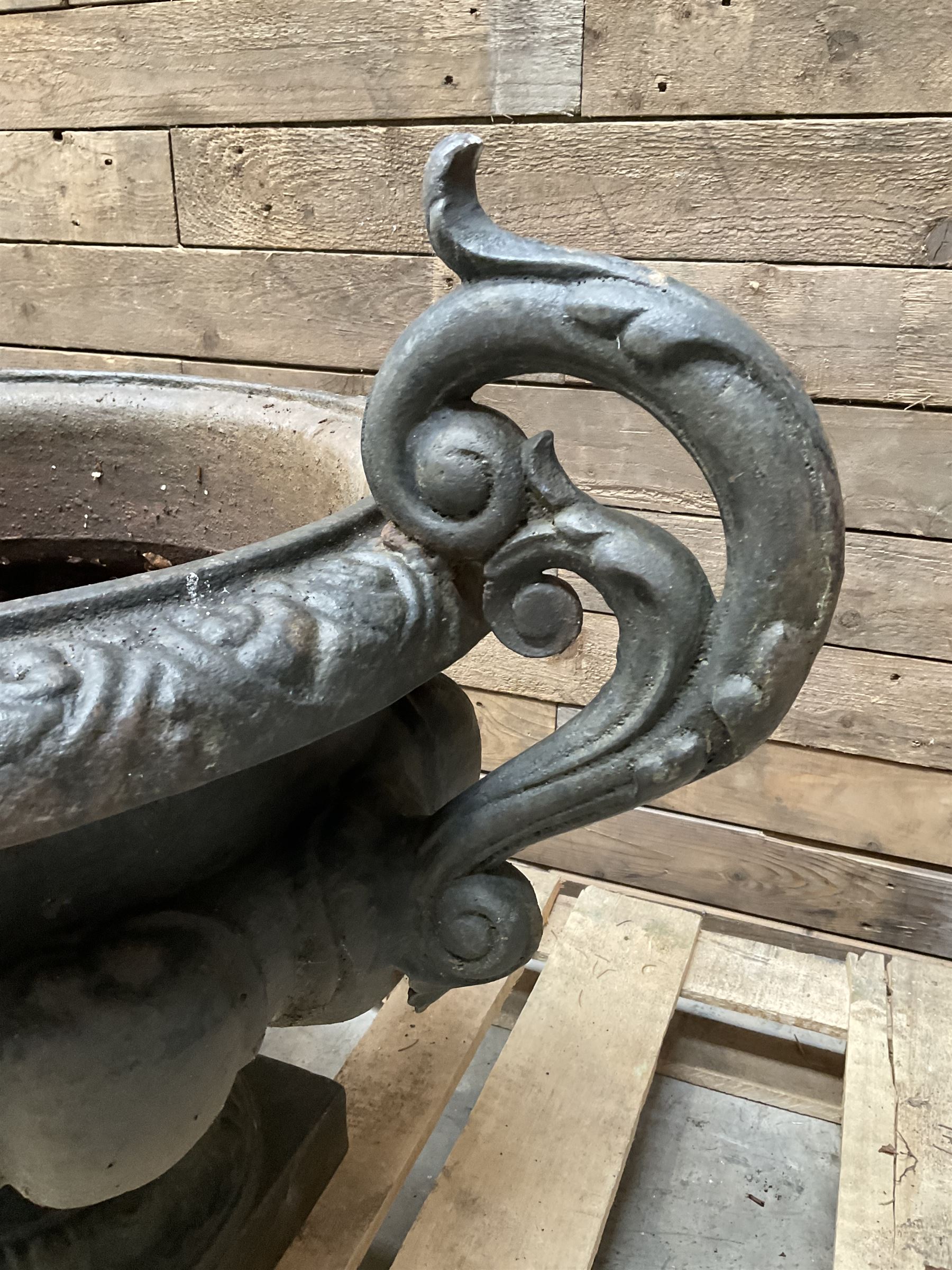 Victorian design ornate cast iron centrepiece urn, featuring two handles, raised on footed base