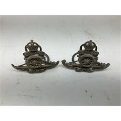 Trench Art - three WW2 brass shell case ashtrays, one mounted with Royal Artillery cap badge and button and one mounted with RA button; together with a pair of place name holders each formed from a Royal Artillery cap badge (5)